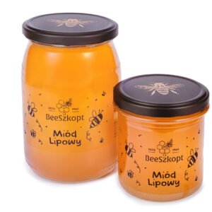 Dwa słoiki miodu lipowego marki BeeSzkopt o różnych gramaturach na białym tle